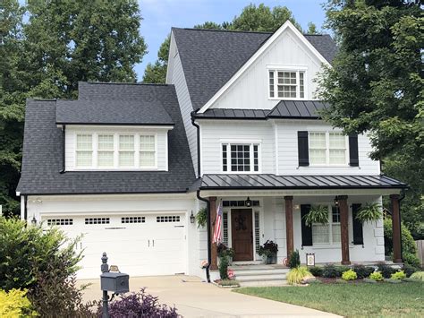 grey brick house with metal roof|white house black metal roof.